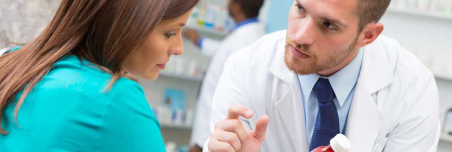 Pharmacist talking with patient